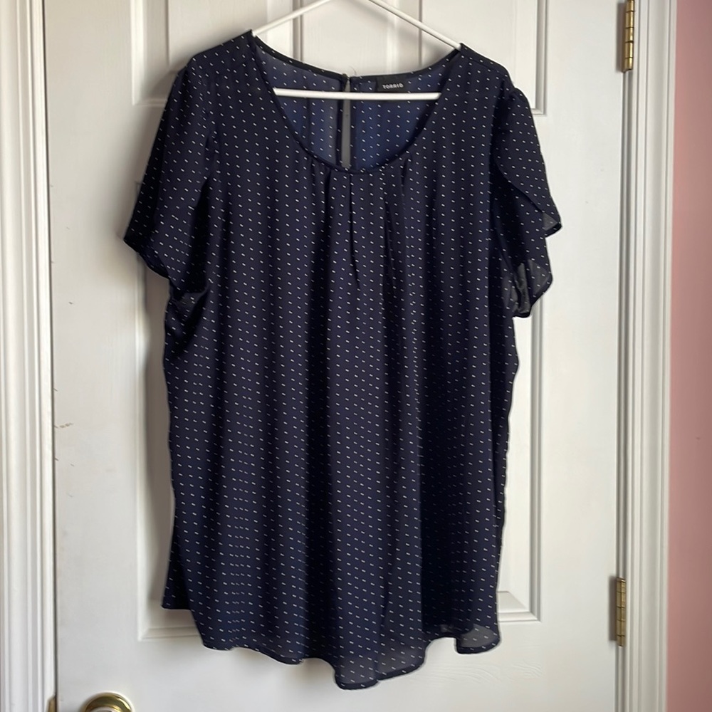 Navy blue polka dotted blouse with flowy short sleeve